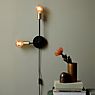 Nordlux Josefine, lámpara de pared negro/latón - ejemplo de uso previsto